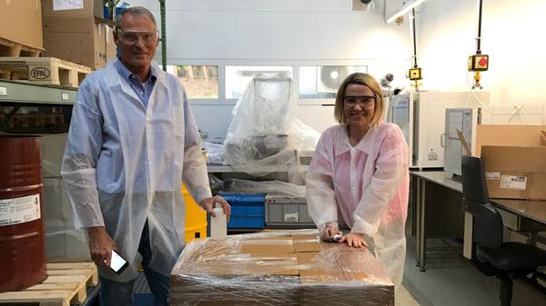 Image of Baxter employees who helped manufacture hand sanitizer for patients.